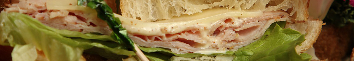 Eating Sandwich at Primo's Sandwich Shops restaurant in Foxborough, MA.